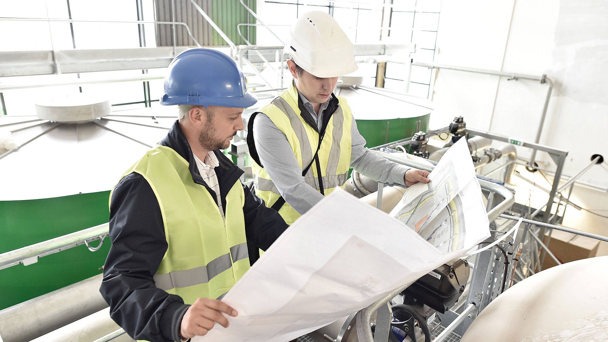 Engineers look over plans