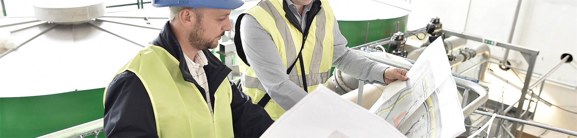 Engineers look over plans