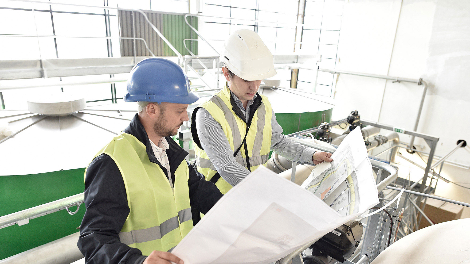 Project partners look over plans