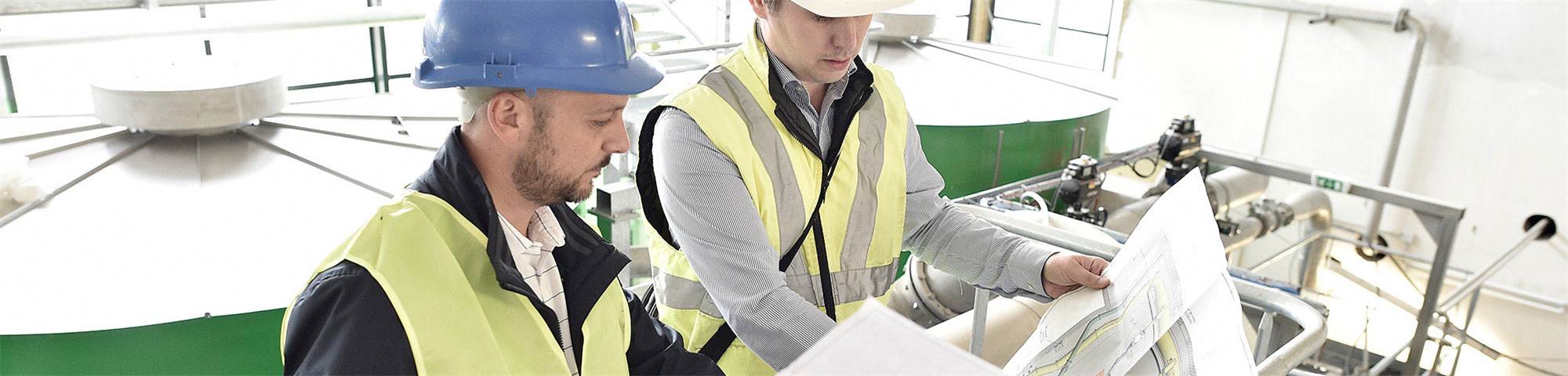 Project partners look over plans