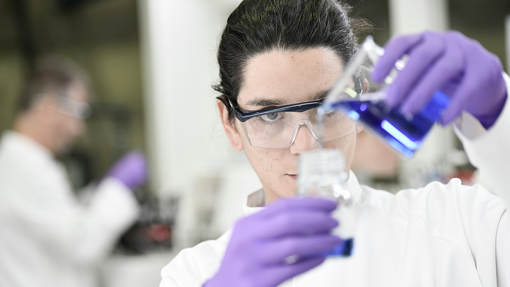 image of lab technician doing tests
