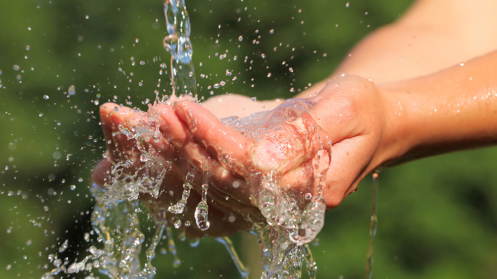 Hands under flowing water
