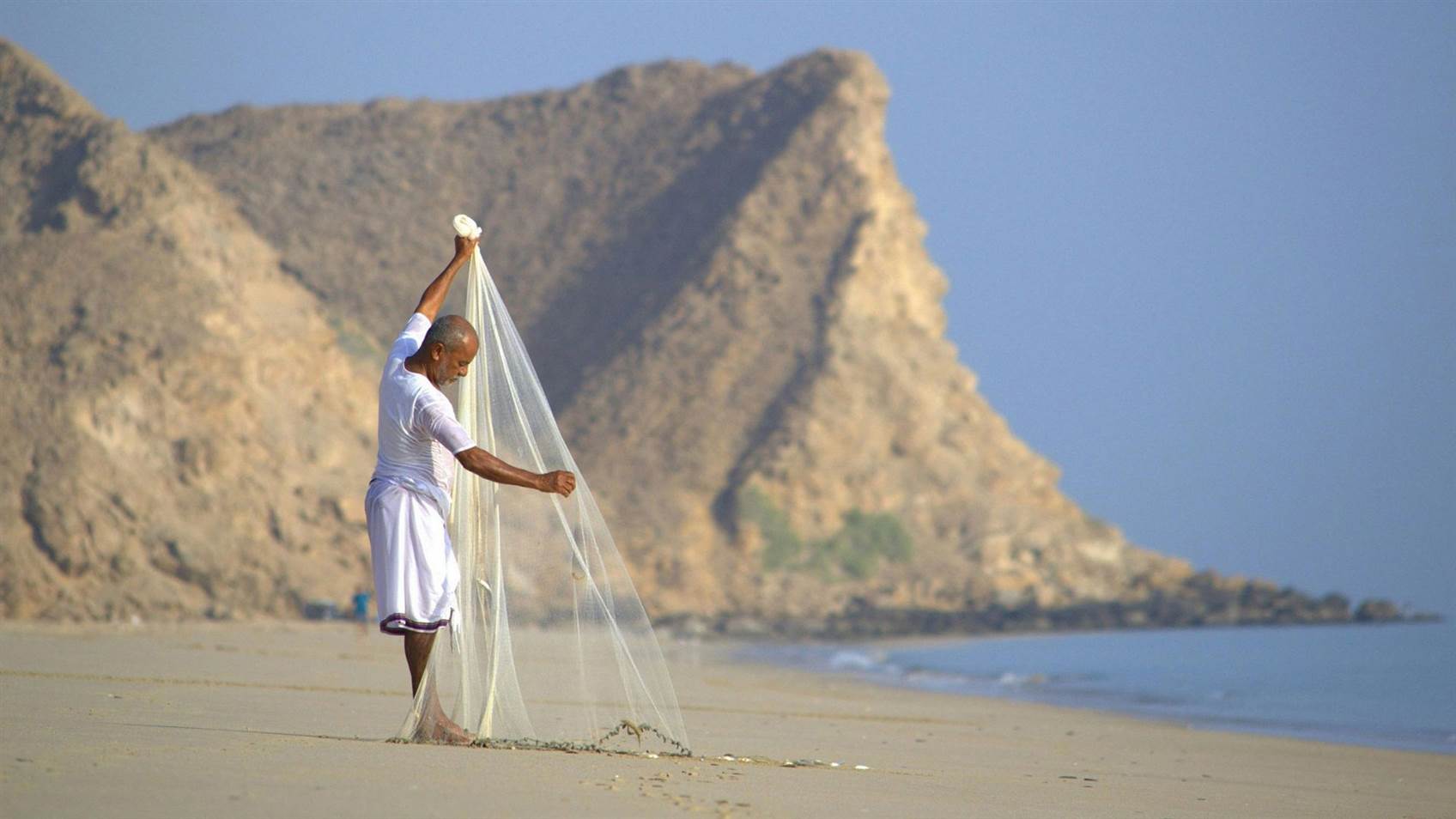 Oman-homme-filet-plage